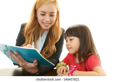 English Teacher With Girl Studying.