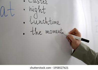 English Teacher Giving Lesson Near Whiteboard, Closeup