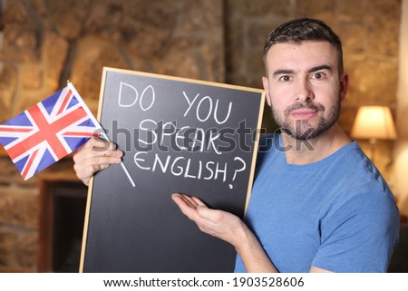 English teacher holding British flag
