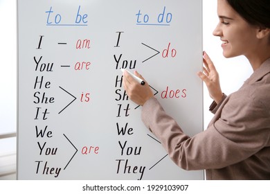 English teacher near whiteboard at lesson, closeup - Shutterstock ID 1929103907