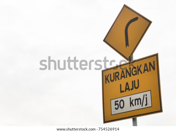 English translation\
of Reduce Speed road\
sign