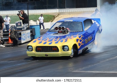 Englishtown, NJ / USA - July 26, 2015: The War Horse Funny Car Performs A Smoky Burnout During A Vintage Drag Racing Event In Englishtown, New Jersey.