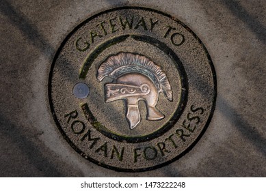 Engraved Stone Of Gateway To Roman Fortress In York With A Roman Soldier Helmet