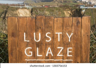 Engraved Wooden Sign for "Lusty Glaze" a Beach in the Popular Seaside Surfing Town of Newquay in Cornwall, England, UK - Shutterstock ID 1303756153