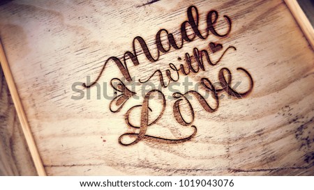 Engraving on wooden box cover