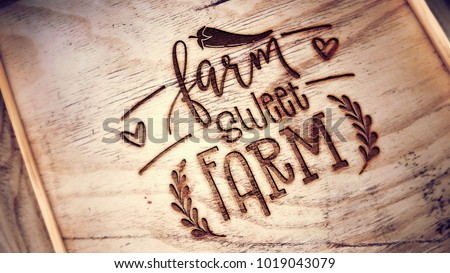 Engraving on wooden box cover