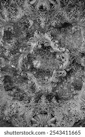 Engraving pattern background on an antique silver plate pewter tray.  Antique vintage metalwork concept.