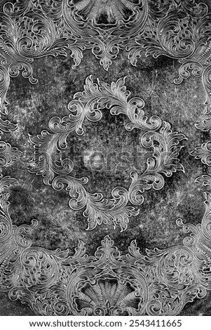 Engraving pattern background on an antique silver plate pewter tray.  Antique vintage metalwork concept.