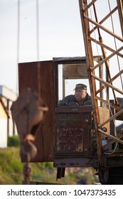 Engure, Latvia - 2012/09/06: Port Crane Operator Unloading Fish In Engure, Latvia