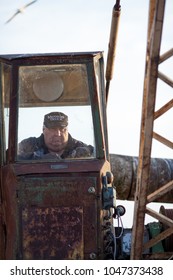 Engure, Latvia - 2012/09/06: Port Crane Operator Unloading Fish In Engure, Latvia