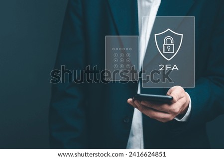 Enhancing cybersecurity with 2FA Two-Factor Authentication, Login Security, User ID Protection, and Encryption to thwart cyber hackers. Businessman holding mobile internet online network.