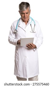 Enior Doctor Using His Tablet Computer In White Background