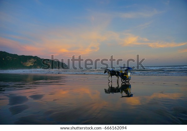 Enjoy Beautiful Sunset Parangtritis Beach While Stock Photo