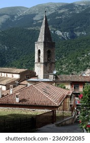 Enjoy a charming view of the bell tower of Santa Maria della Valle Church nestled within the small village of Scanno, Italy. This picturesque scene captures the essence of historical beauty.