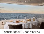 Enjoy an Elegant Dining Experience on a Luxury Yacht While Overlooking the Beautiful Ocean