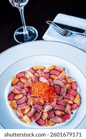 Enjoy festive gourmet carpaccio topped with exquisite caviar—ideal for celebrations!
