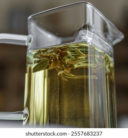 Enjoy a Herbal Tea Infusion served in an Elegant Glass Pitcher, enhancing your experience - Powered by Shutterstock