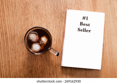 Enjoy Reading A Number Best Selling Book With A Glass Of Iced Coffee.