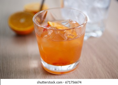 Enjoy refreshing tequila sunrise long drink in the bar.Juicy cocktails for party.Crystal glass with orange juice & booze.Hot drinks for adult people