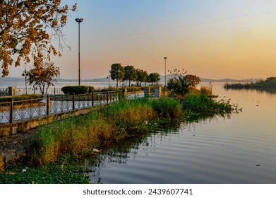 Enjoy the serenity of nature at this beautiful park. Lush greenery, towering trees, and a tranquil atmosphere invite you to relax and unwind in the great outdoors. - Powered by Shutterstock