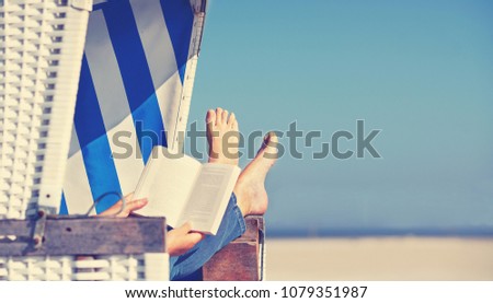 enjoy summer day at baltic sea in beach chair