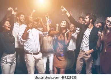 Enjoying the best party with friends. Group of beautiful young people dancing together and looking happy - Shutterstock ID 499229638