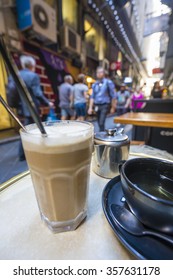 Enjoying coffee and tea at a cafe in a laneway, shallow depth of view