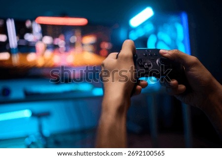 Enjoying an exciting gaming session with a controller and large screen for immersive gameplay