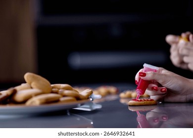 Enjoying a funfilled quality time while decorating delightful cookies with vibrant icing and colorful sprinkles.