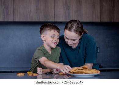 Enjoying a funfilled quality time while decorating delightful cookies with vibrant icing and colorful sprinkles.