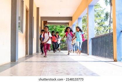 Enjoying Group Of Kids Running At School Corridor For Going To Classroom - Concept Of Education, Reopen School, Active Childhood And Learning.