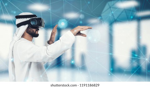 Enjoying new experience. Handsome Arab man in VR headset gesturing while standing against grey background