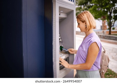 Enjoying summer in Greece while using an ATM machine