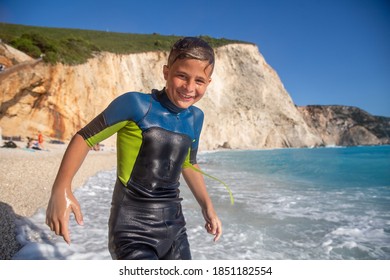 Enjoying summer and having great fun with big waves on an idyllic beach in Mediteranean