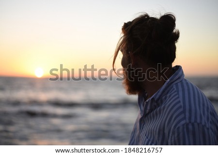 Enjoying the sunset at the beach, man silouette enjoying summer, holiday beach icons