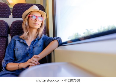 Enjoying Travel. Young Pretty Woman Traveling By The Train Sitting Near The Window.