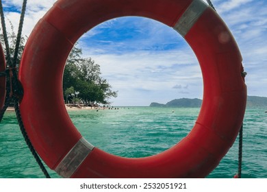 Enjoying the vibrant waters of Mamutik Island, Malaysia, through the lifebuoy on a clear sunny day - Powered by Shutterstock