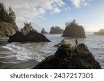 Enjoying the view of the rocky shore line and sea stacks of this stretch of coast line in southern Oregon, Secret beach around sunset.