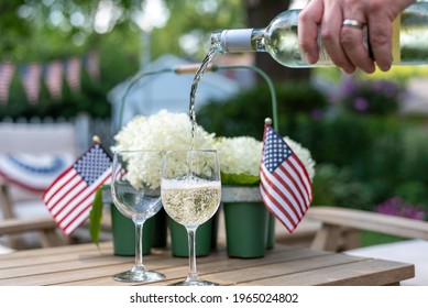 Enjoying Wine In The Backyard In Summertime