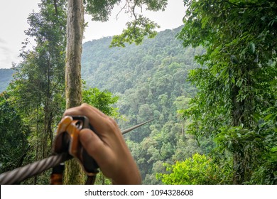 Enjoying With A Zipline Adventure Across The Mountain For Watch The Scenery Of The Sky And Forest.