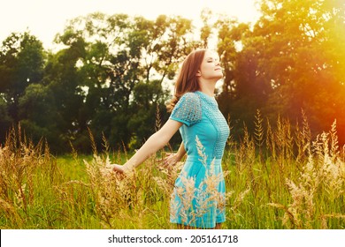 Enjoyment. Free Happy Woman Enjoying Nature. Beauty Girl Outdoor. Freedom Concept. Beauty Girl Over Sun