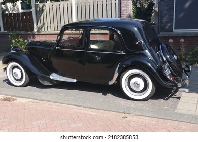 Enkhuizen, The Netherlands - July 17 2022: Black Classic Citroën Traction Avant Car With White Wall Tyres Parked On Street