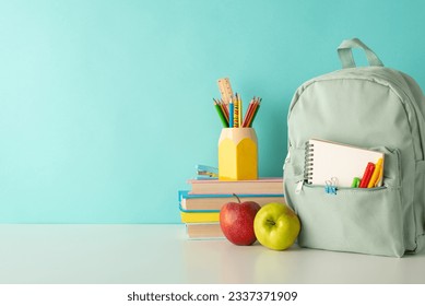 Enliven the classroom atmosphere with side-view image of cheerful school supplies, penholder, books and rucksack on white desk on blue isolated background, offering space for text or advert inclusion - Powered by Shutterstock