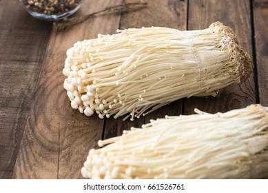 Enoki Mushrooms On Wood