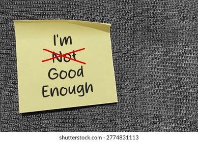 I am enough message with correction mark representing self acceptance and confidence.