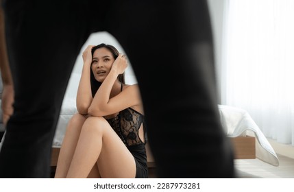 The enraged man tightened his hand to hit the frightened woman in the background. The concept of family and physical abuse - Shutterstock ID 2287973281