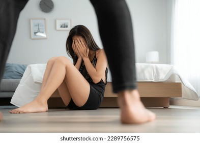 The enraged man tightened his hand to hit the frightened woman in the background. The concept of family and physical abuse - Shutterstock ID 2289756575