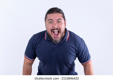 An enraged stocky man in his 30s screams in extreme rage. Showing threatening body language or shouting at someone.