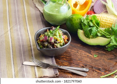 Ensalada De Frijoles Y Maiz, Mexican Corn Salad With Creamy Avocado Dressing And Ingredients Surrounding