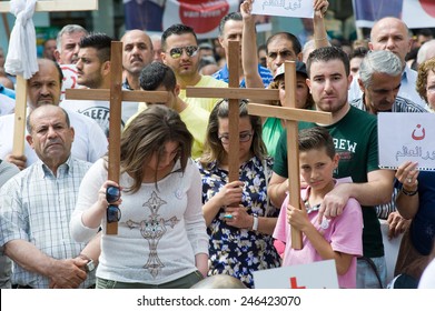 ENSCHEDE, NETHERLANDS - AUG 03, 2014: During A Demonstration Organized By Suryoye Christians Against The Slaughter Of Christians In The Middle East There Is A Minut Of Silence For Those Who Are Dead